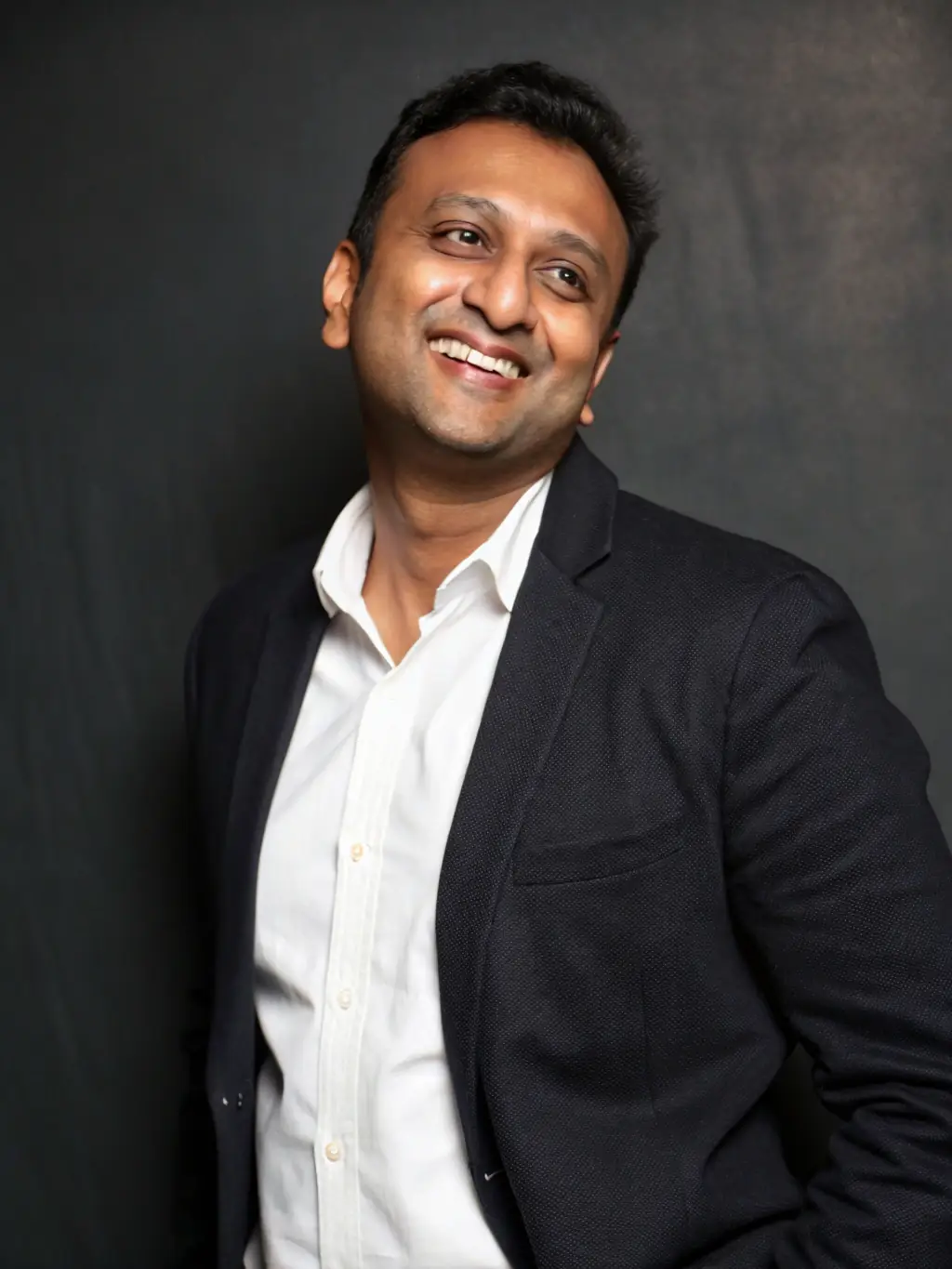 A professional headshot of Mr. Rohan Patel, a prominent venture capitalist investing in early-stage Indian startups, looking confident and approachable.